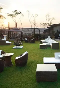Green lawn event space at Della Resorts Lonavala